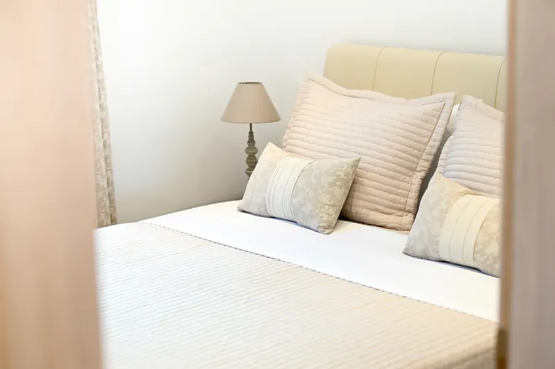 Pillows and linen on a made bed