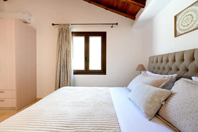 A bedroom made up in white