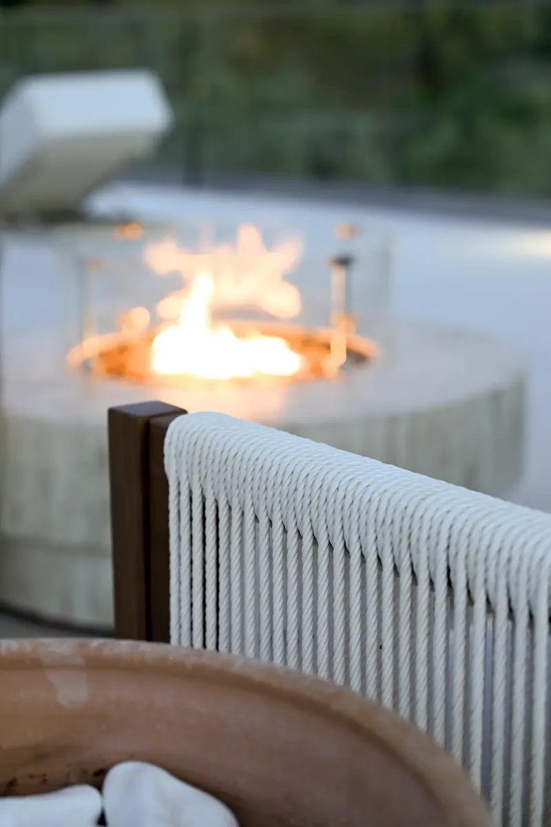 The fire burning in its stone bowl