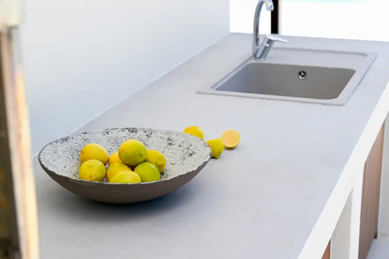A bowl of lemons on the kitchen worktop