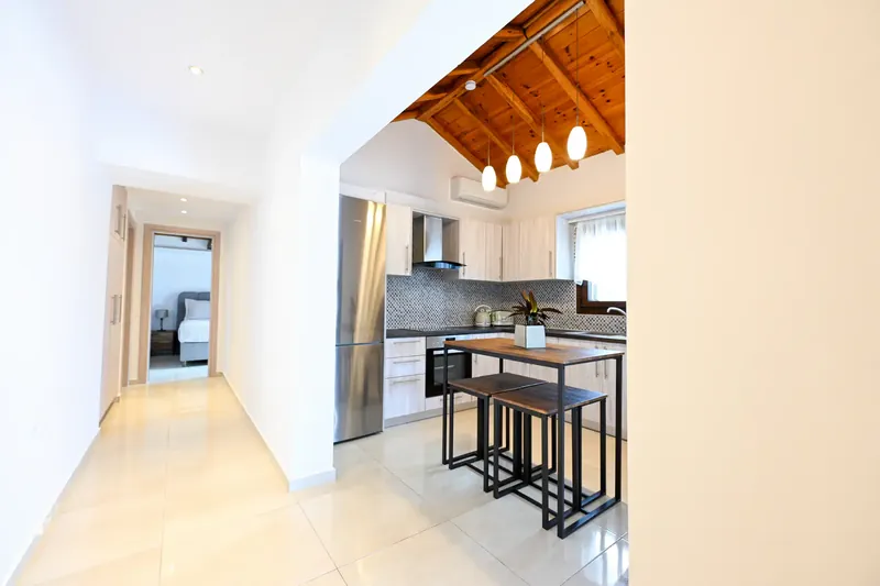 The hall, with the kitchen and dining table beyond