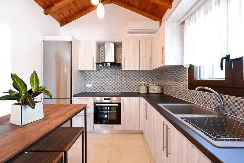 The kitchen, with its oven and wooden worktop