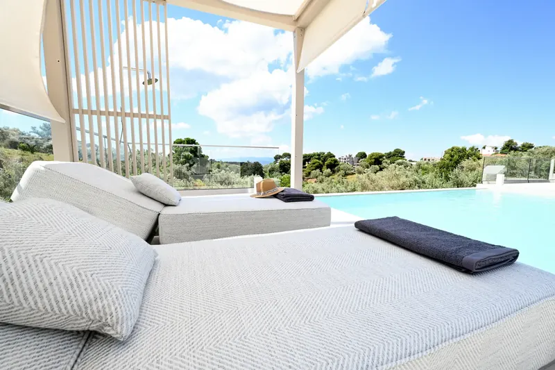 Sun loungers at the water's edge