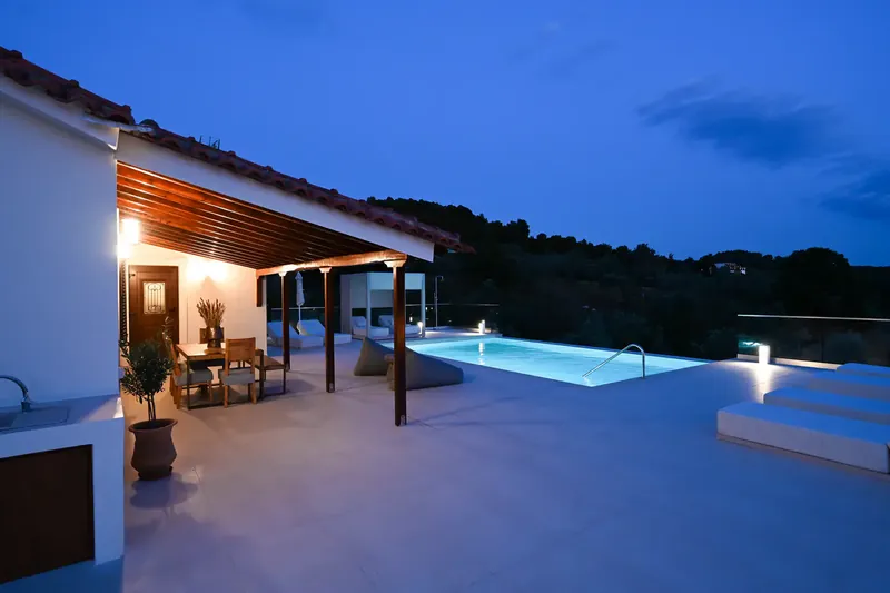 The pool lit from within after dark