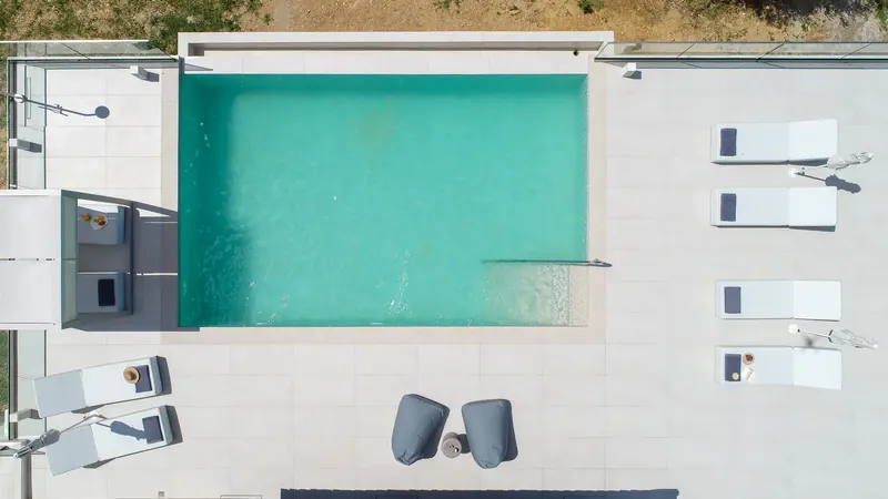 The pool and sun loungers directly from above