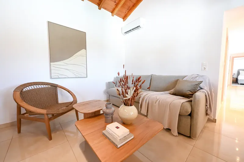 An armchair and low table in the sitting area