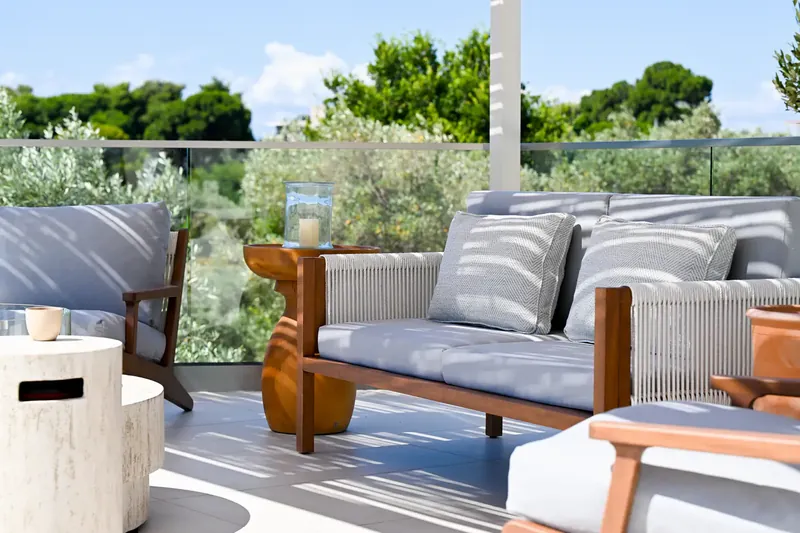 Outdoor seating on the terrace among the olives