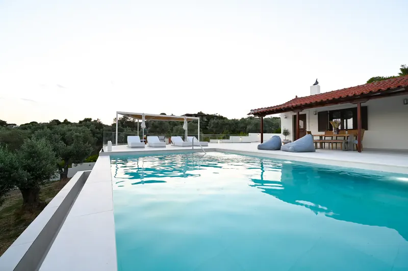 Emerald Diamond Villa behind its private pool, with the olive grove around it
