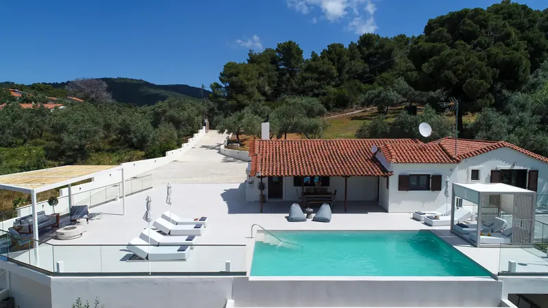 The villa, its pool and terrace seen from the air